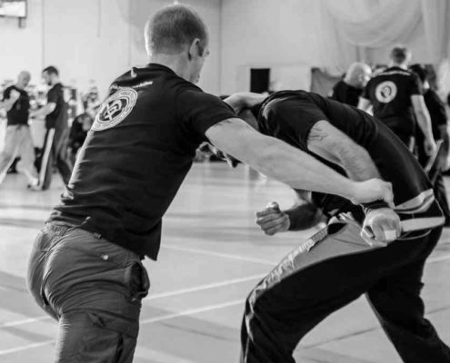 Krav Maga training session focusing on combat psychology and effective response techniques